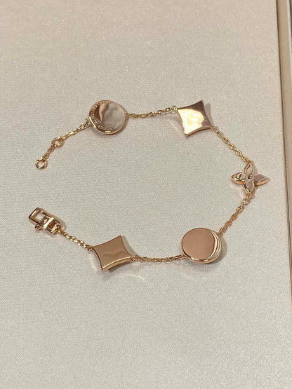[Super Jewellery]STAR AND SUN 5 MOTIF MOP PINK GOLD BRACELET